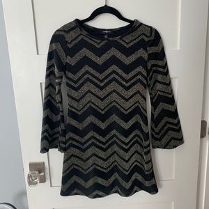 Super cute gold and black dress with zigzags.